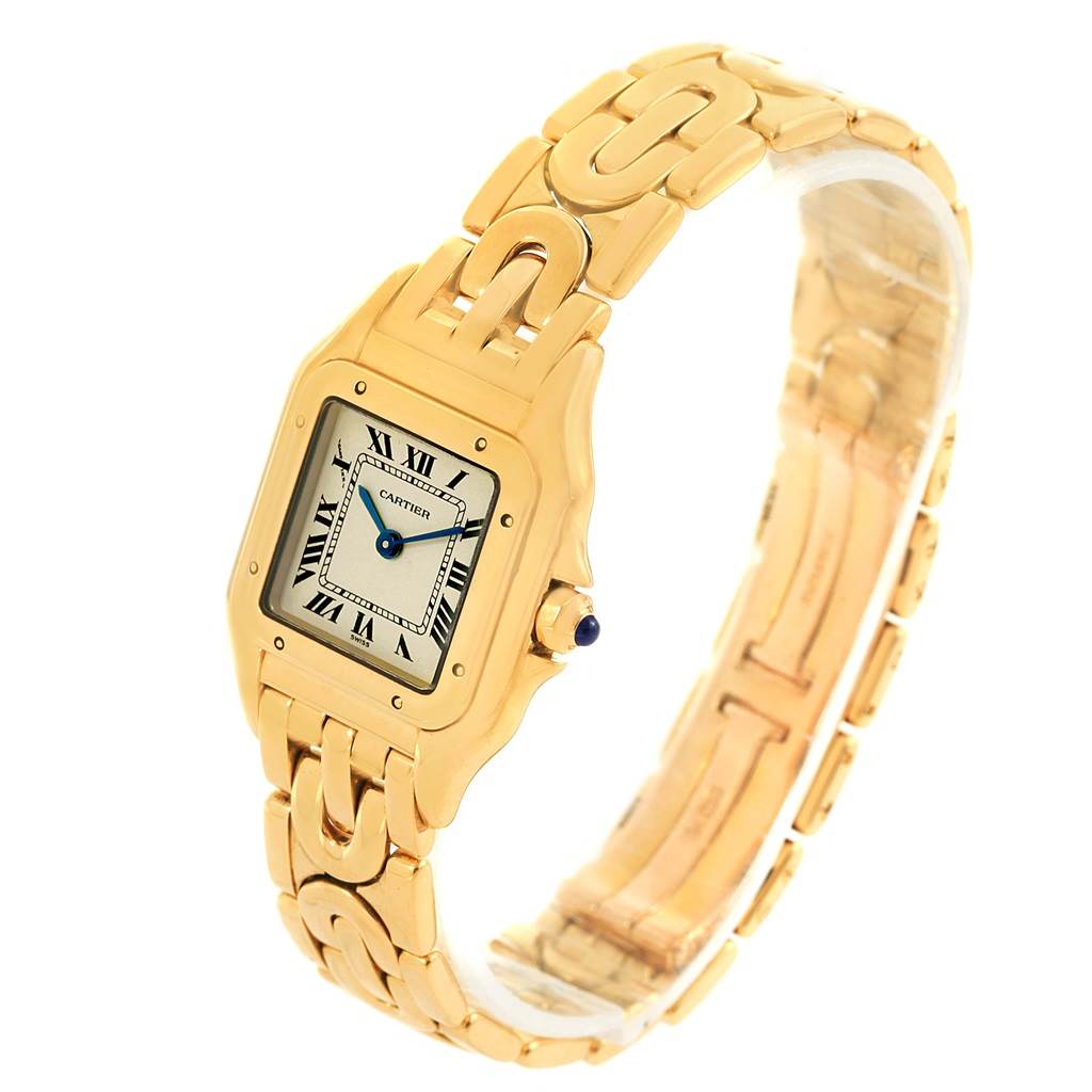 The image shows a gold Cartier Panthère watch, viewed at a slight angle, displaying the dial and part of the bracelet.