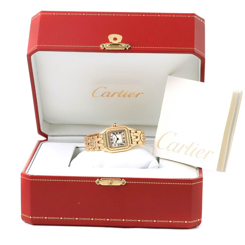 The image shows a Cartier Panthère watch inside its red presentation box, accompanied by a booklet.