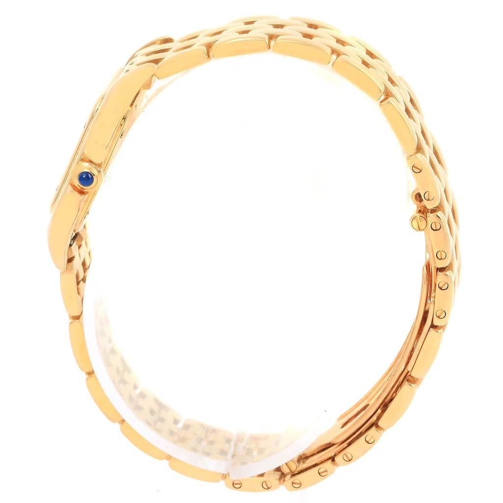 This side-view image of the Cartier Panthere W25022B9 Women's Yellow Gold Beige Dial W25022B9 Women's Yellow Gold Beige Dial watch showcases its gold bracelet and blue cabochon crown.