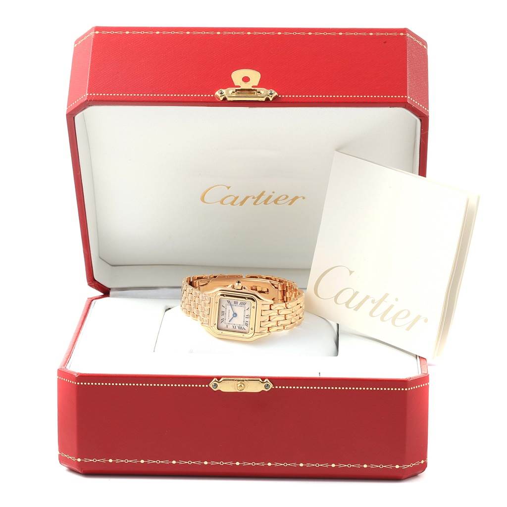The Cartier Panthere W25022B9 Women's Yellow Gold Beige Dial W25022B9 Women's Yellow Gold Beige Dial watch is shown at a front angle inside its open red box with an accompanying booklet.