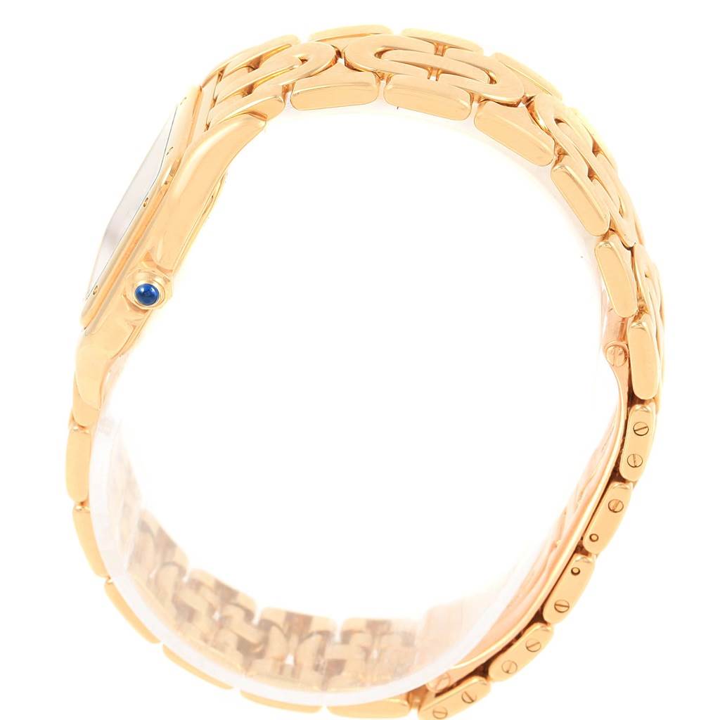 The image shows a side profile of the Cartier Panthere 1070 Women's Yellow Gold Silver Dial 1070 Women's Yellow Gold Silver Dial watch, highlighting the gold bracelet, case, and crown with a blue cabochon.