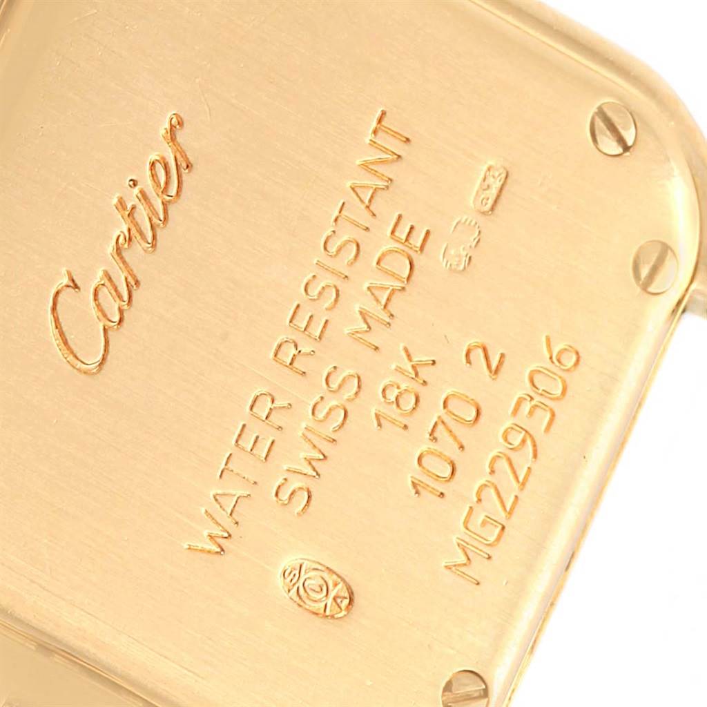 This image shows the back casing of a Cartier Panthere WF3070B9 Women's Yellow Gold Silver Dial WF3070B9 Women's Yellow Gold Silver Dial model watch, highlighting its inscriptions and screws.