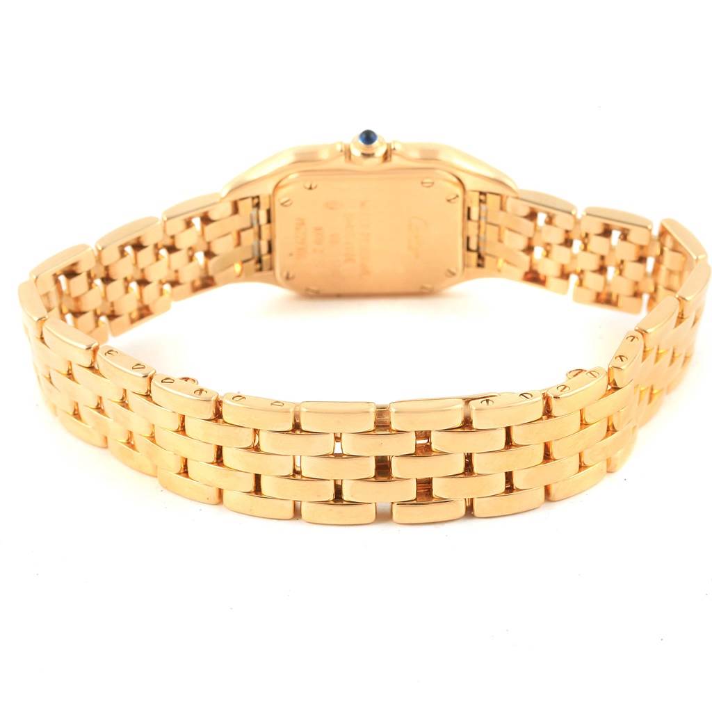 This image shows the back view of the Panthere model by Cartier, focusing on the gold bracelet and case back.