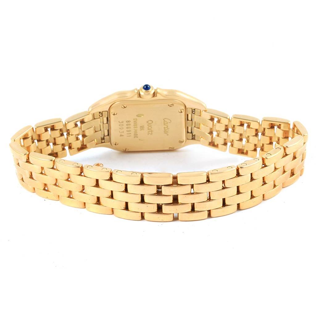 The image shows the back view of the Panthère de Cartier watch, showcasing its gold bracelet and case back.