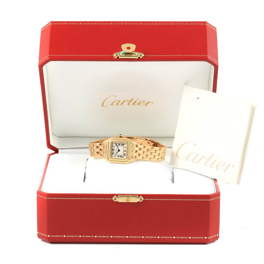 The image shows a Cartier Panthère watch inside its open red presentation box, accompanied by a Cartier booklet.