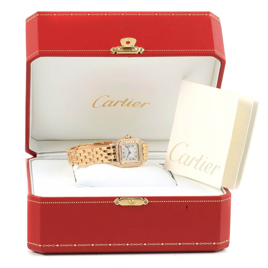 The Panthere model by Cartier is displayed at a front angle in an open red Cartier box, with accompanying documentation.