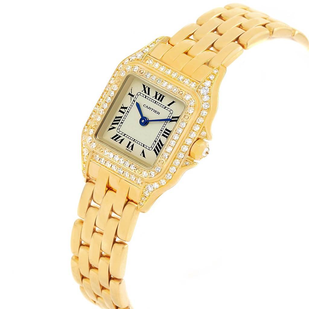 The image shows a Panthere model by Cartier from an angled top-down view, highlighting its gold bracelet, diamond bezel, and Roman numeral dial.