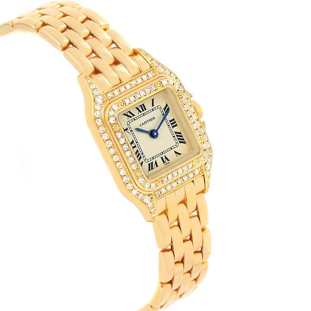 This image shows an angled view of a Cartier Panthere WF3072B9 Women
s Yellow Gold Silver Dial WF3072B9 Women
s Yellow Gold Silver Dial model watch, highlighting its gold bracelet, diamond bezel, and Roman numeral dial.