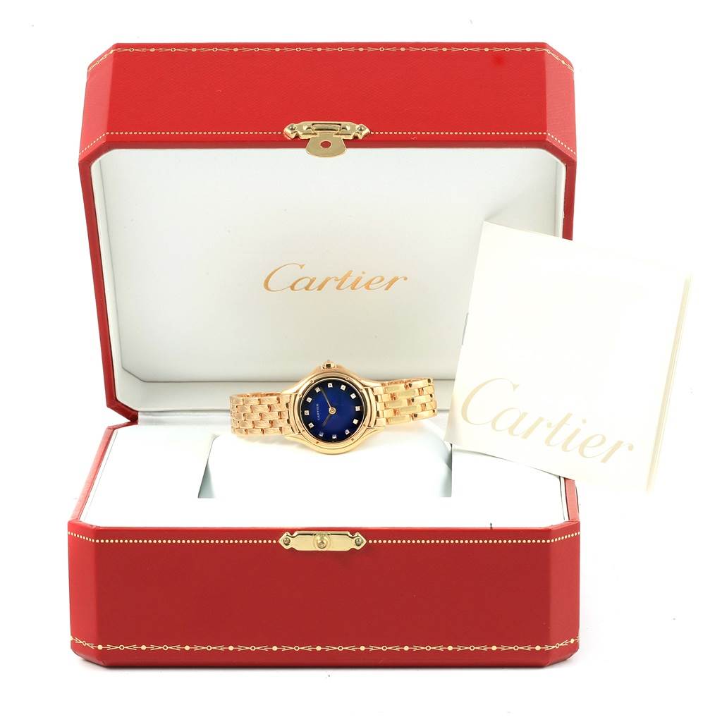 The Panthere model by Cartier is shown from the front in an open red box, displaying the watch and documentation.