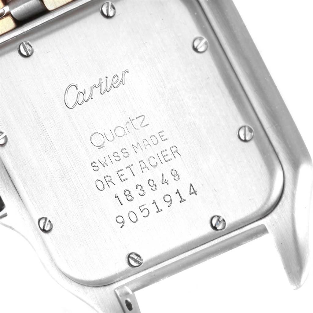 The image shows the case back of a Cartier Panthere W25028B6 Steel and Gold (two tone) Silver Dial W25028B6 Steel and Gold (two tone) Silver Dial model watch, highlighting the engravings and screws.
