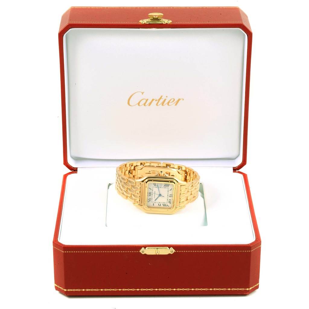 The Cartier Panthere W25014B9 Men's Yellow Gold Silver Dial W25014B9 Men's Yellow Gold Silver Dial watch is shown inside an open red Cartier box, displaying its face and gold bracelet.