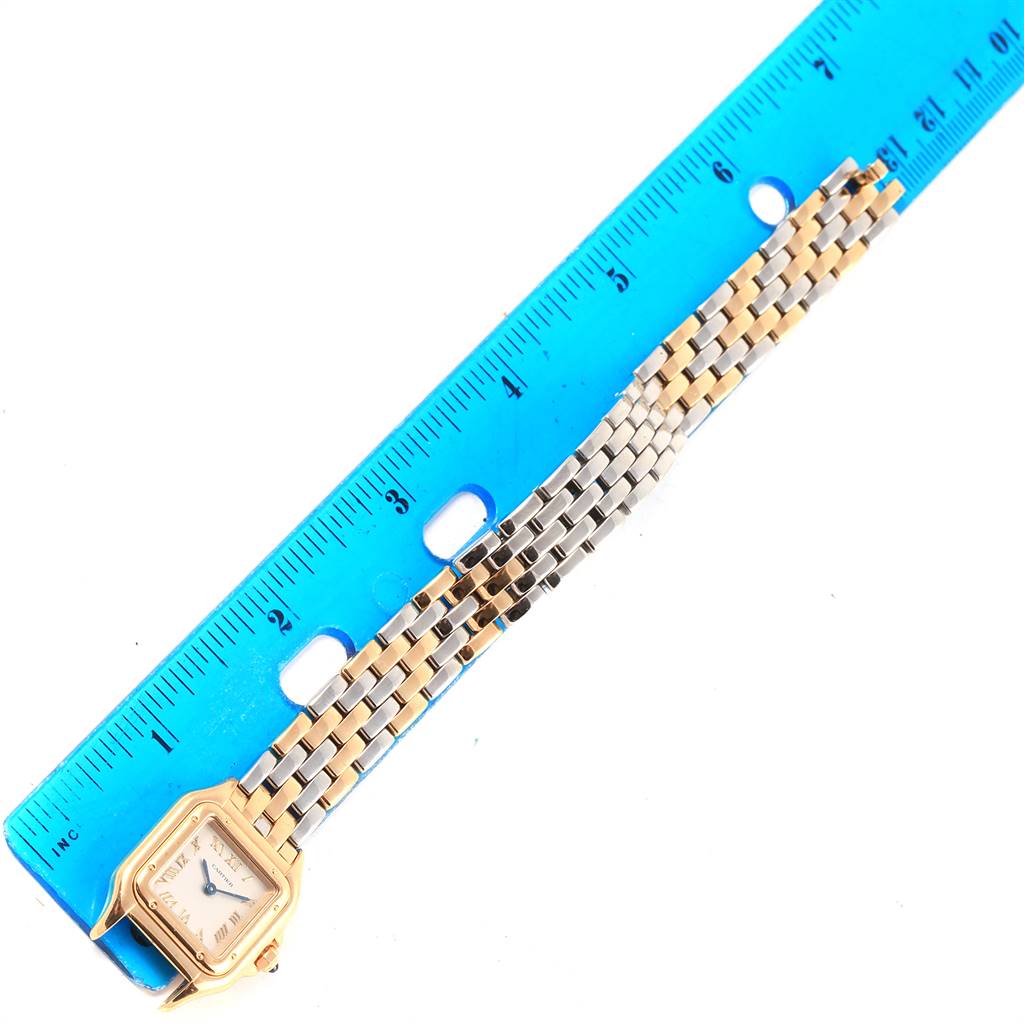 The image shows the face and bracelet of a Cartier Panthere 1070 Women's Yellow Gold Grey Dial 1070 Women's Yellow Gold Grey Dial model watch, positioned next to a blue ruler for scale.