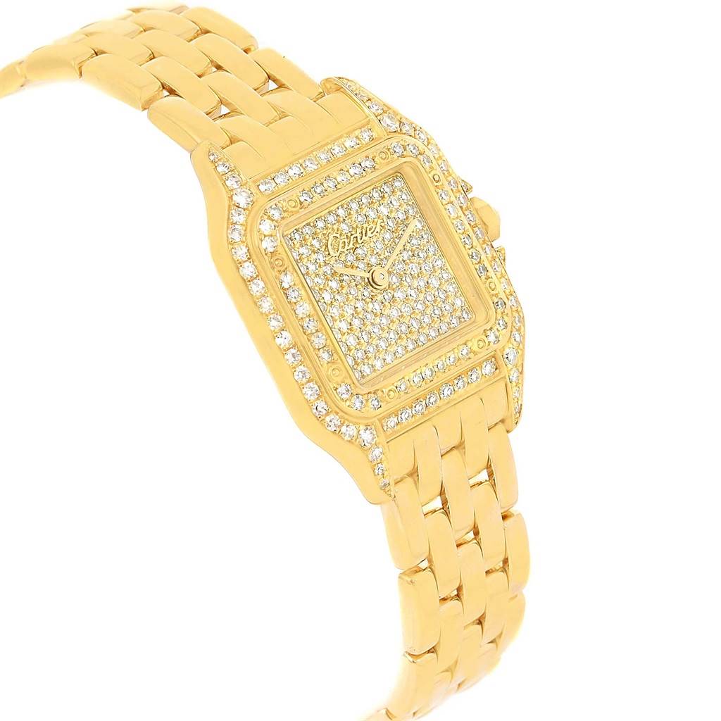The image shows a gold Cartier Panthère watch angled from the left, displaying its diamond-studded face and bracelet.