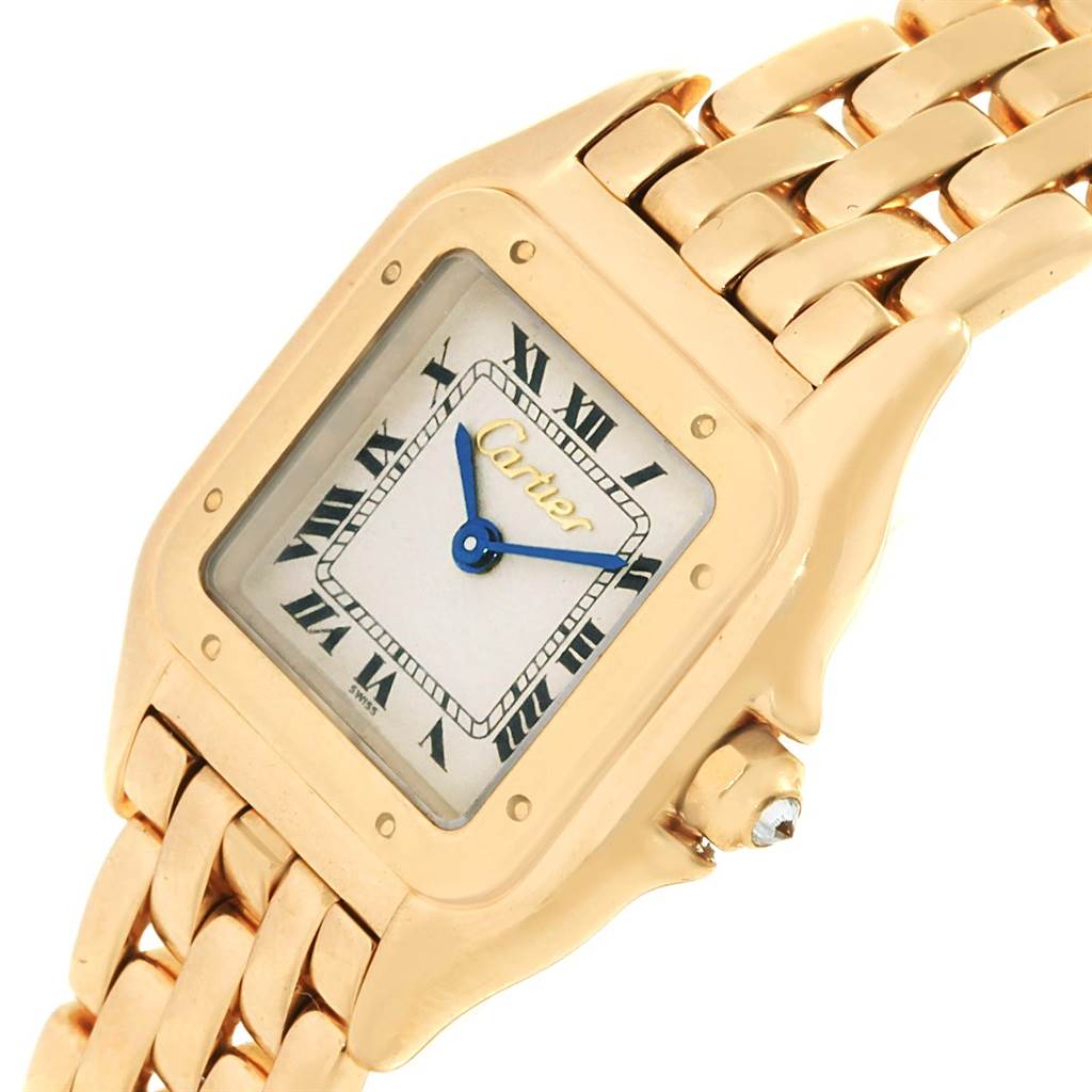 This image shows a close-up of a Cartier Panthère watch's face and part of its gold bracelet.