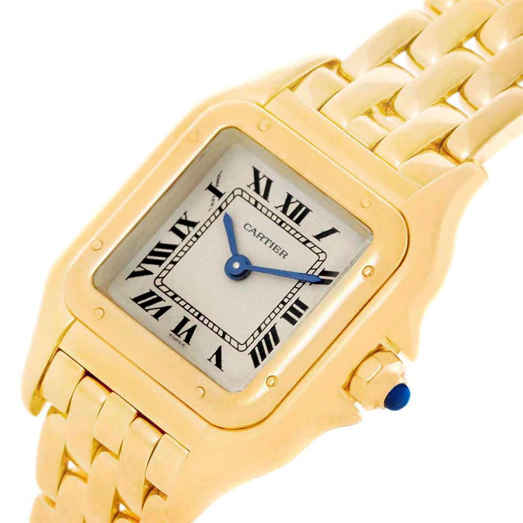 The image shows a close-up view of the Cartier Panthere W25022B9 Women's Yellow Gold Silver Dial W25022B9 Women's Yellow Gold Silver Dial model watch, highlighting its gold case, Roman numeral dial, and metal bracelet.