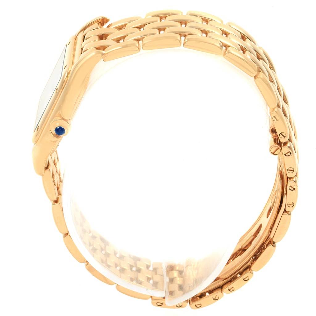 This image shows a side view angle of the Cartier Panthere W25022B9 Women's Yellow Gold Silver Dial W25022B9 Women's Yellow Gold Silver Dial model watch, focusing on the band and the crown with a blue cabochon.