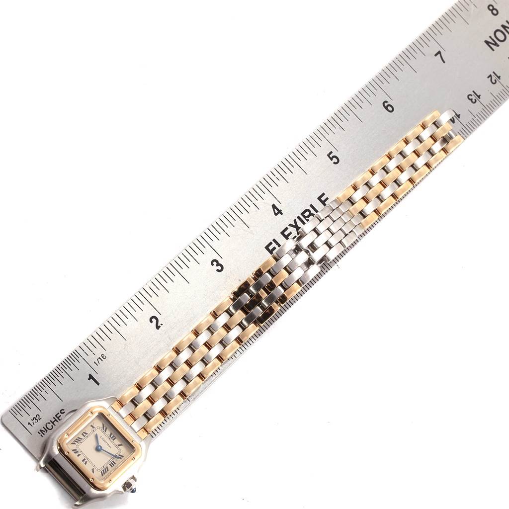 The image shows the Cartier Panthere W25029B6 Women's Stainless Steel Beige Dial W25029B6 Women's Stainless Steel Beige Dial model watch laid flat next to a ruler, highlighting its face and bracelet.