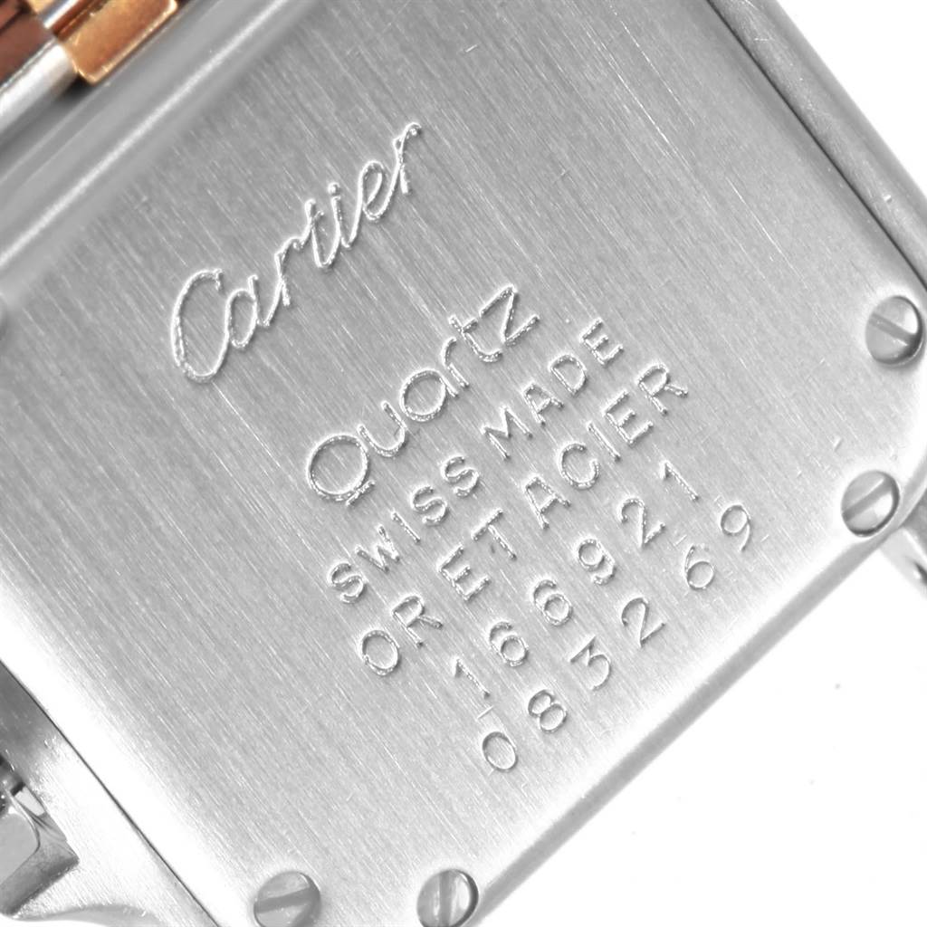 The image shows the back case of a Cartier Panthere W25029B6 Women's Stainless Steel Beige Dial W25029B6 Women's Stainless Steel Beige Dial Quartz watch, highlighting its engravings and screws.