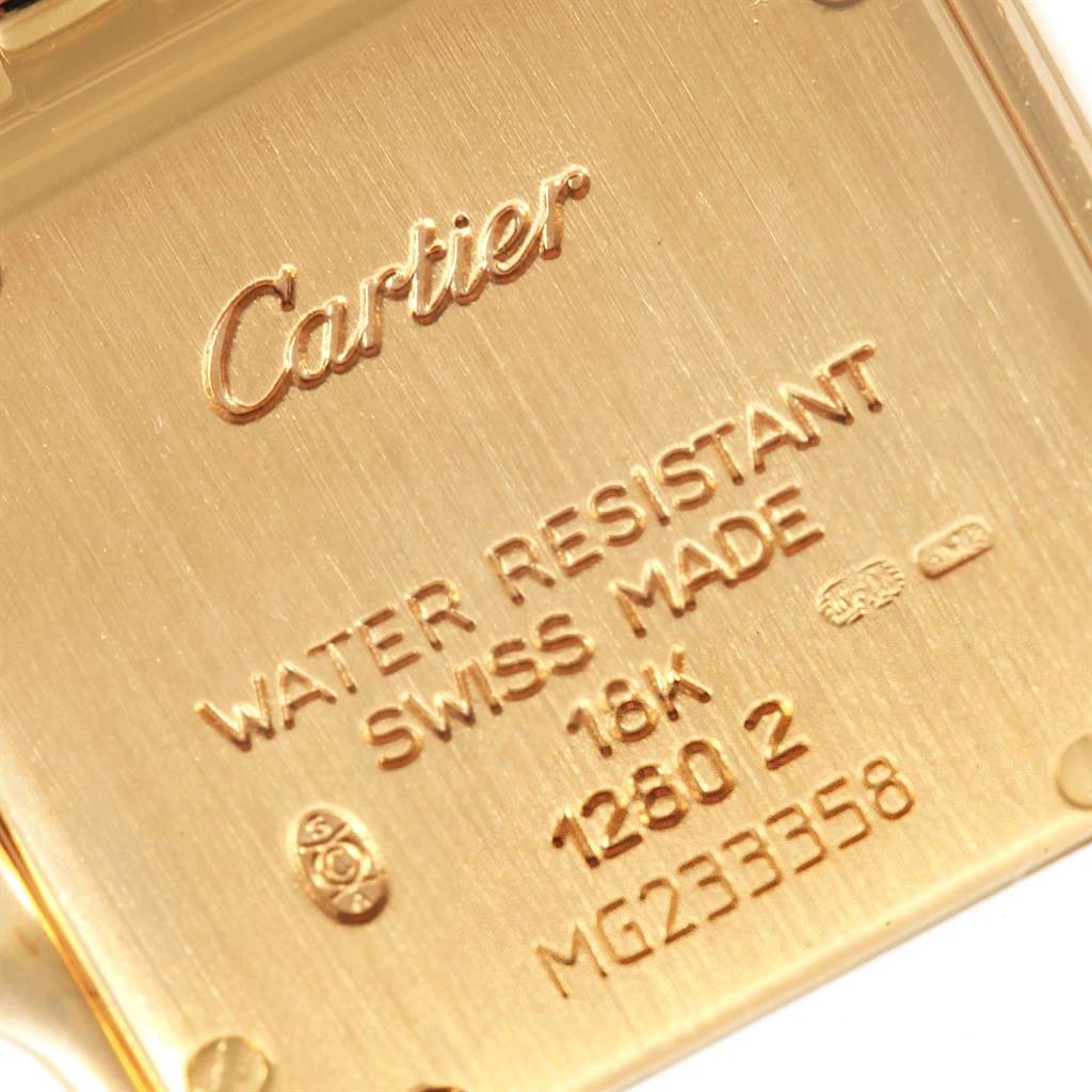 This image shows the back case of a Cartier Panthere WF3072B9 Women's Yellow Gold Silver Dial WF3072B9 Women's Yellow Gold Silver Dial watch, highlighting the brand name, model details, and material specifications.