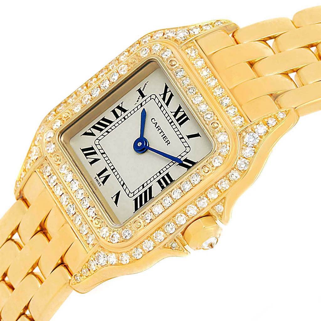 The image shows a close-up angle of the dial and bracelet of a Cartier Panthere WF3072B9 Women's Yellow Gold Silver Dial WF3072B9 Women's Yellow Gold Silver Dial watch, highlighting its gold and diamond detailing.