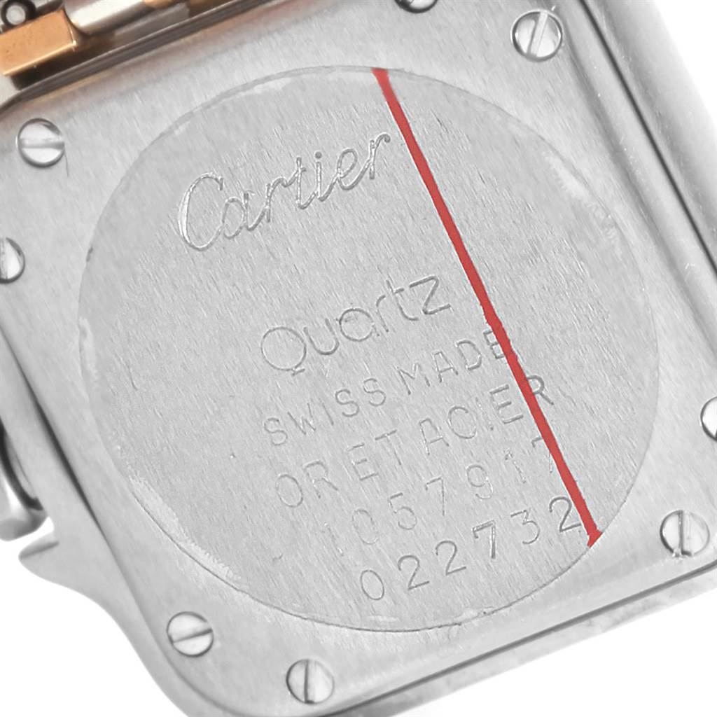 The image shows the back case of a Cartier Panthere W25029B6 Women's Stainless Steel Beige Dial W25029B6 Women's Stainless Steel Beige Dial watch, highlighting the inscriptions and screws.