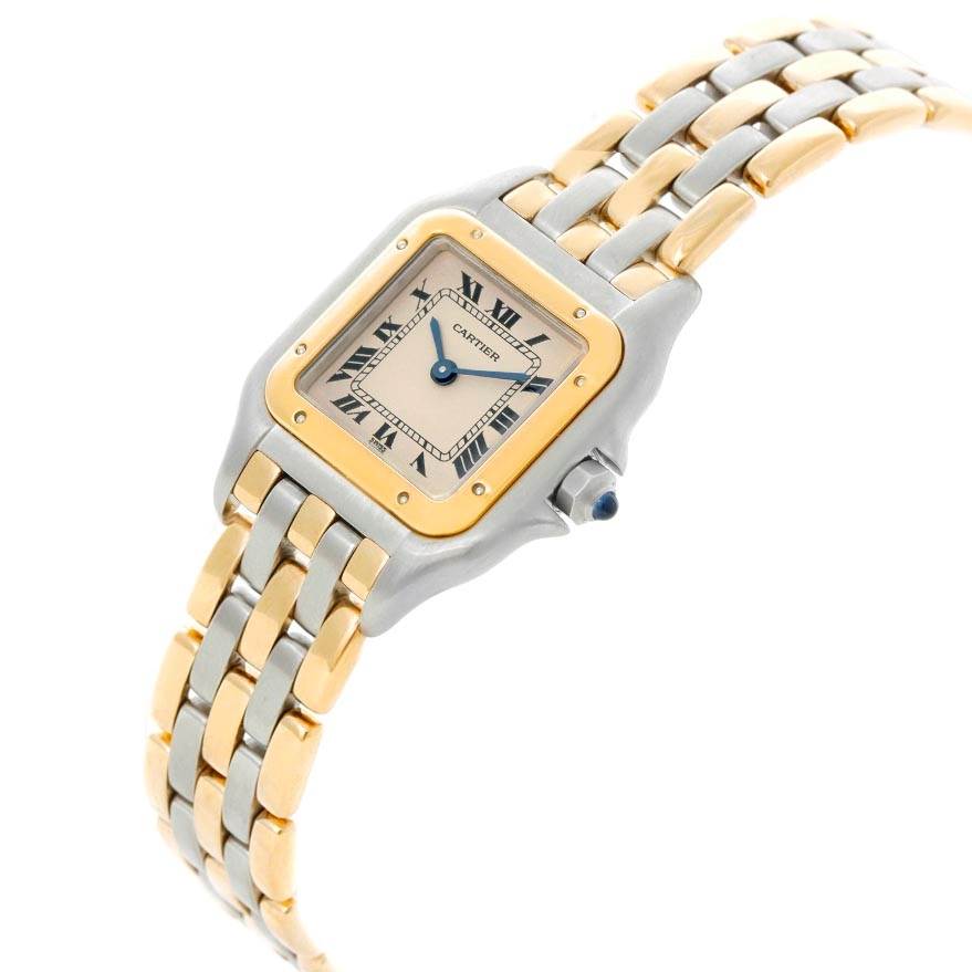 The image shows a Cartier Panthère watch from an angled view, displaying its two-tone band, square face, and blue hands.