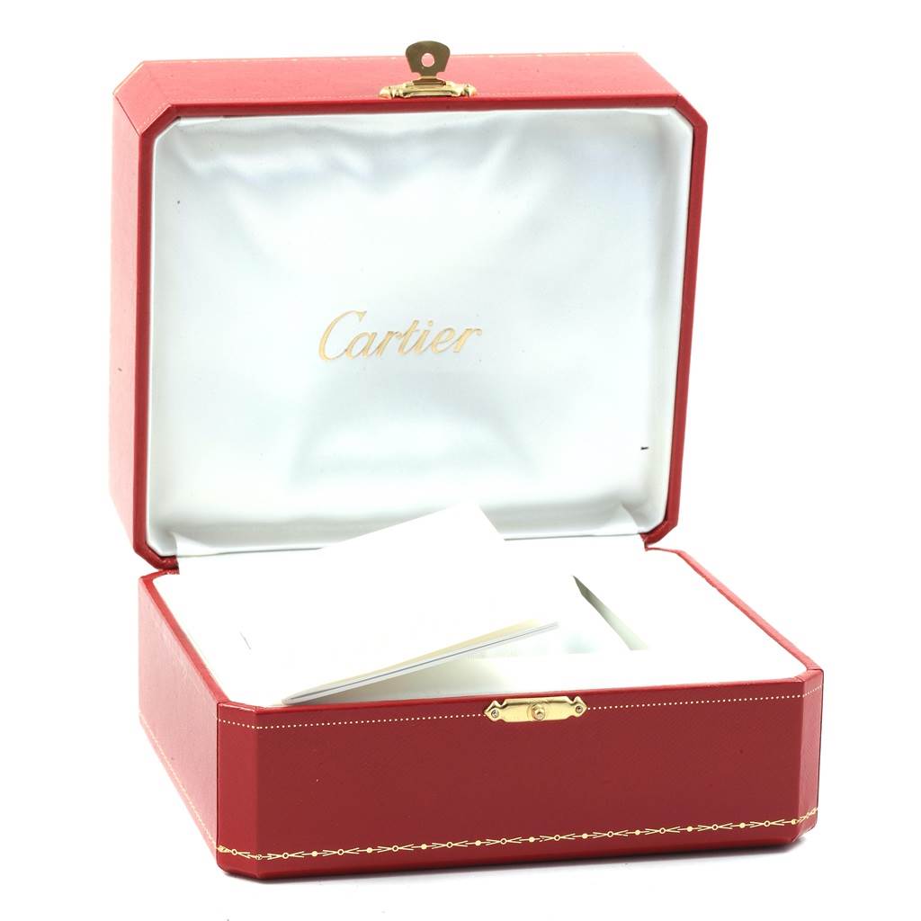 This image shows an open Cartier watch box for the Panthere model, lined with white fabric and containing booklets.