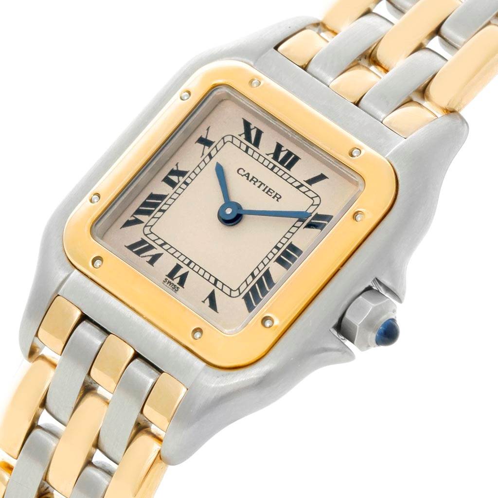 This image shows a close-up of the Panthere model watch by Cartier, highlighting its dial, crown, and bracelet.