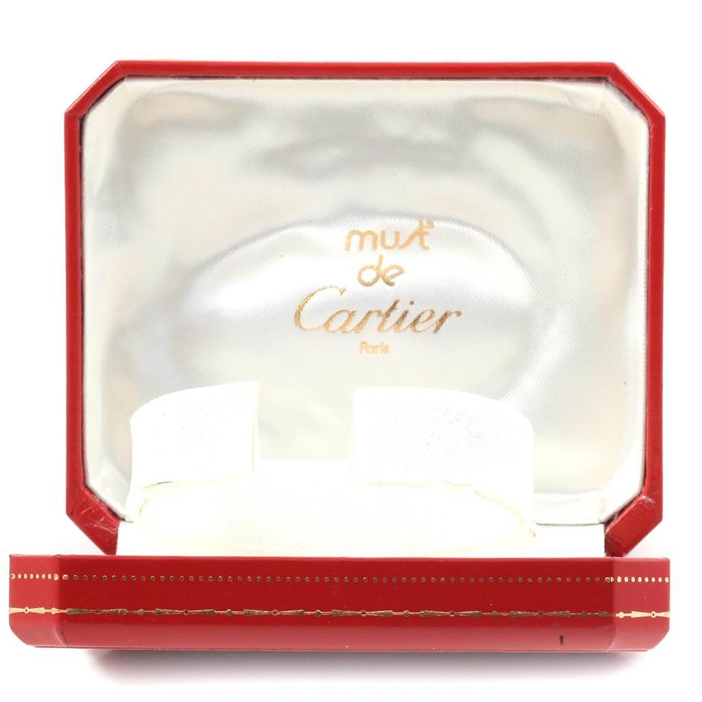 The image shows an empty red and white "must de Cartier" watch box angled open, with no visible parts of the Panthere model watch.
