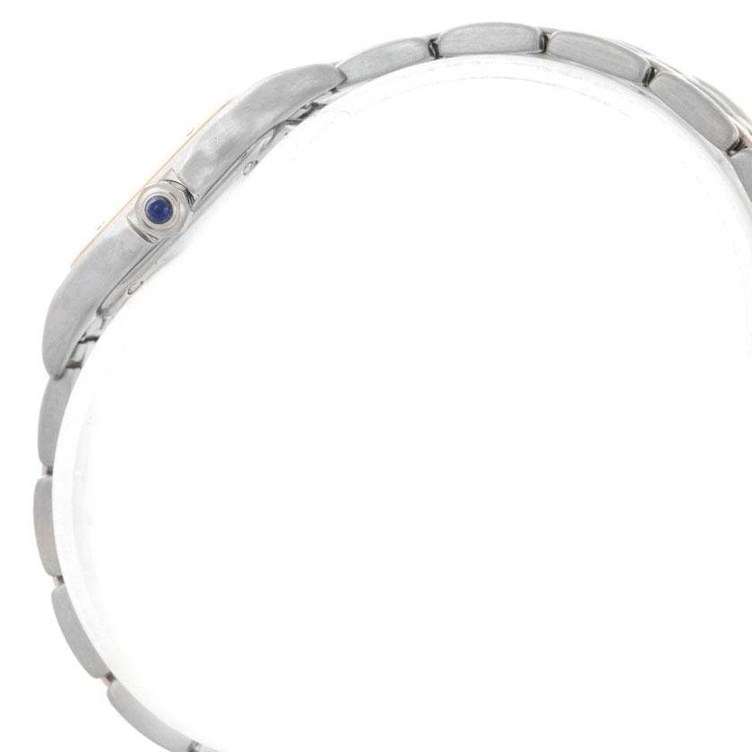 The image shows a side view and partial glimpse of the bracelet of the Cartier Panthere W25029B6 Women
s Stainless Steel Silver Dial W25029B6 Women
s Stainless Steel Silver Dial watch, featuring a blue cabochon crown.
