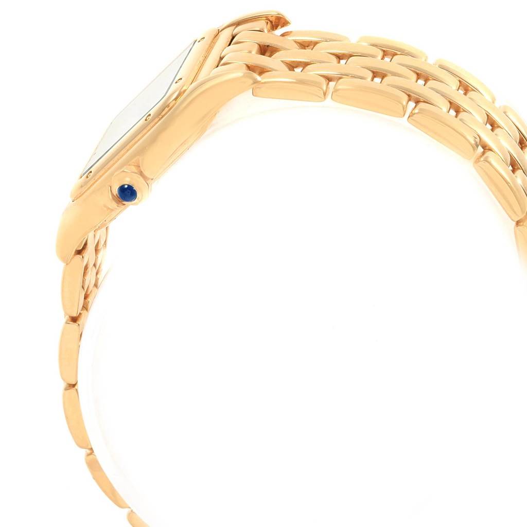 The image shows a side view of a Cartier Panthere W25022B9 Women's Yellow Gold Silver Dial W25022B9 Women's Yellow Gold Silver Dial watch, highlighting its gold bracelet and blue cabochon crown.