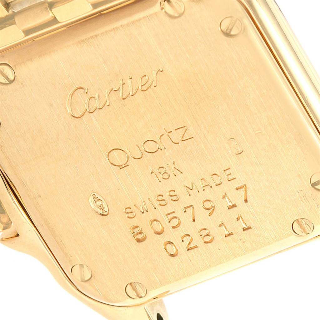 The image shows the back case of a Cartier Panthere W25022B9 Women's Yellow Gold Silver Dial W25022B9 Women's Yellow Gold Silver Dial model watch, highlighting the engravings and screws.