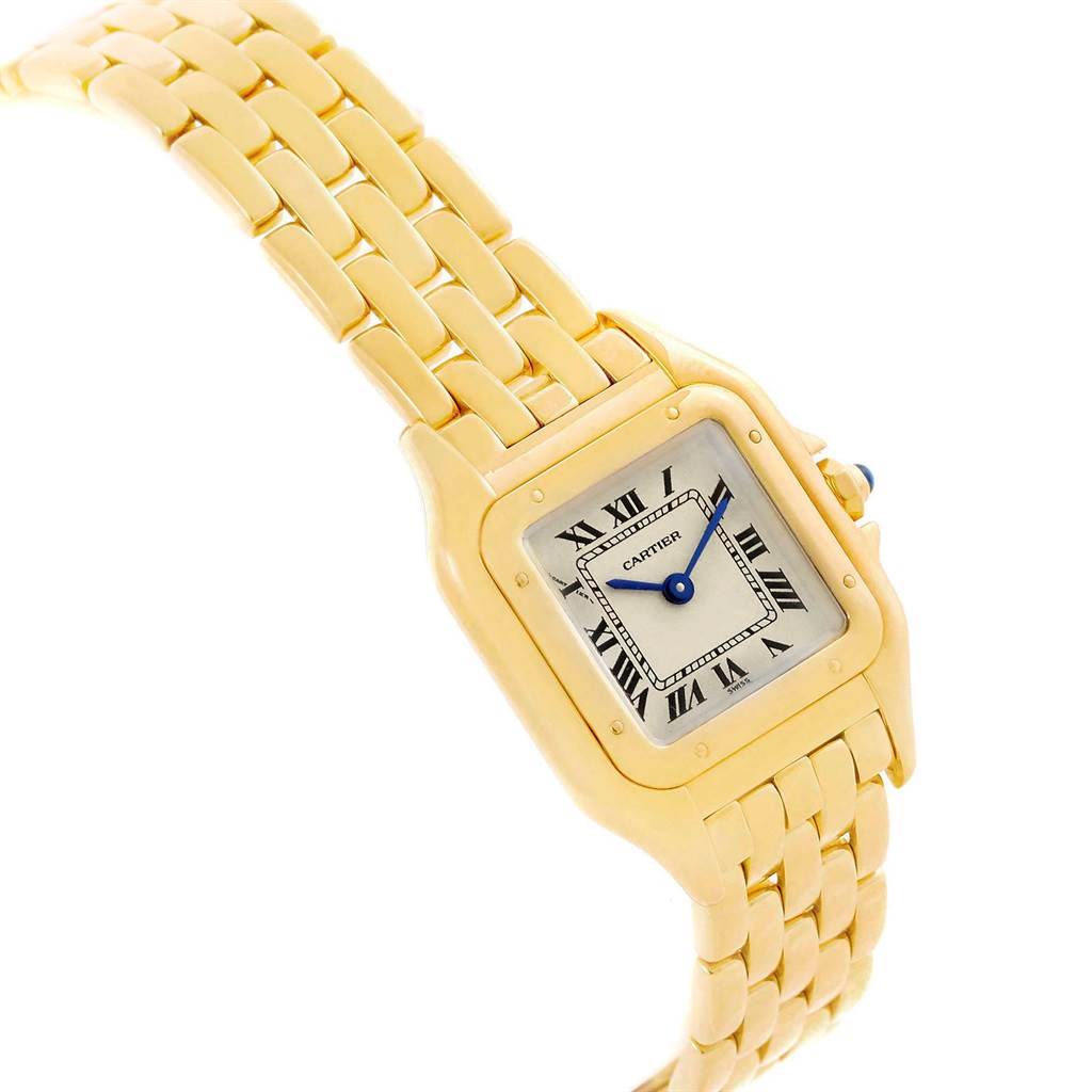 The Cartier Panthere W25022B9 Women's Yellow Gold Silver Dial W25022B9 Women's Yellow Gold Silver Dial watch is shown at an angled close-up, displaying the gold bracelet, square face, and signature blue hands.