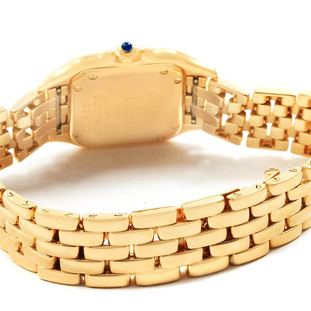 The image shows the back case and gold bracelet of a Cartier Panthere W25022B9 Women's Yellow Gold Silver Dial W25022B9 Women's Yellow Gold Silver Dial watch from a slightly tilted angle.