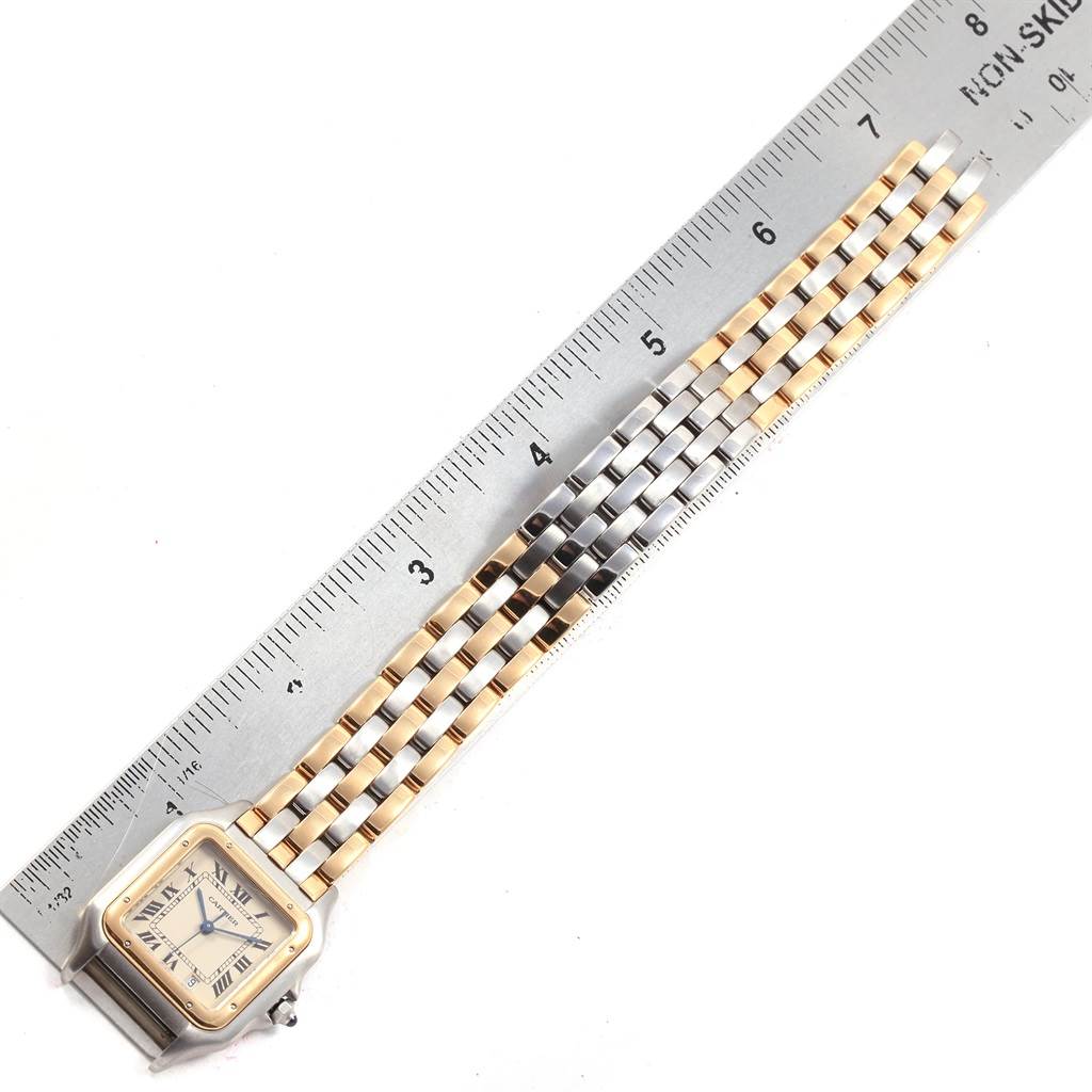 The image shows a Cartier Panthere W25029B6 Women's Stainless Steel Beige Dial W25029B6 Women's Stainless Steel Beige Dial watch laid flat next to a ruler, highlighting its bracelet and face.