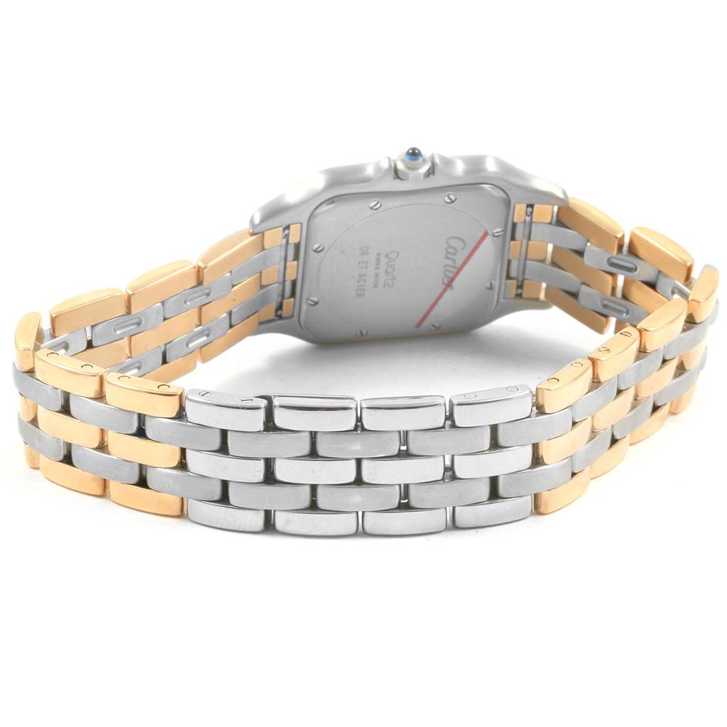 The image shows the back view of a two-tone Panthere model by Cartier, highlighting the case back and bracelet.