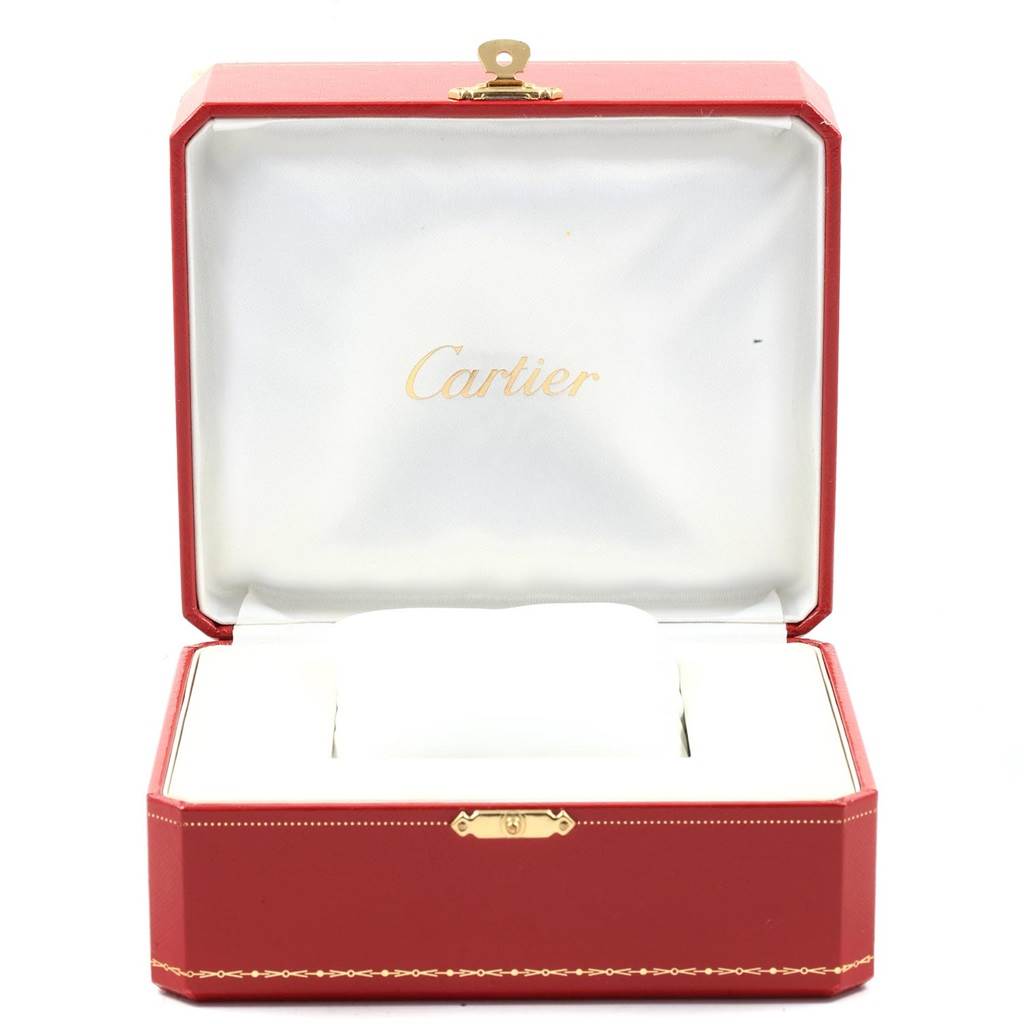 The image shows a Cartier Panthère model watch box, red with a white interior, open and empty.