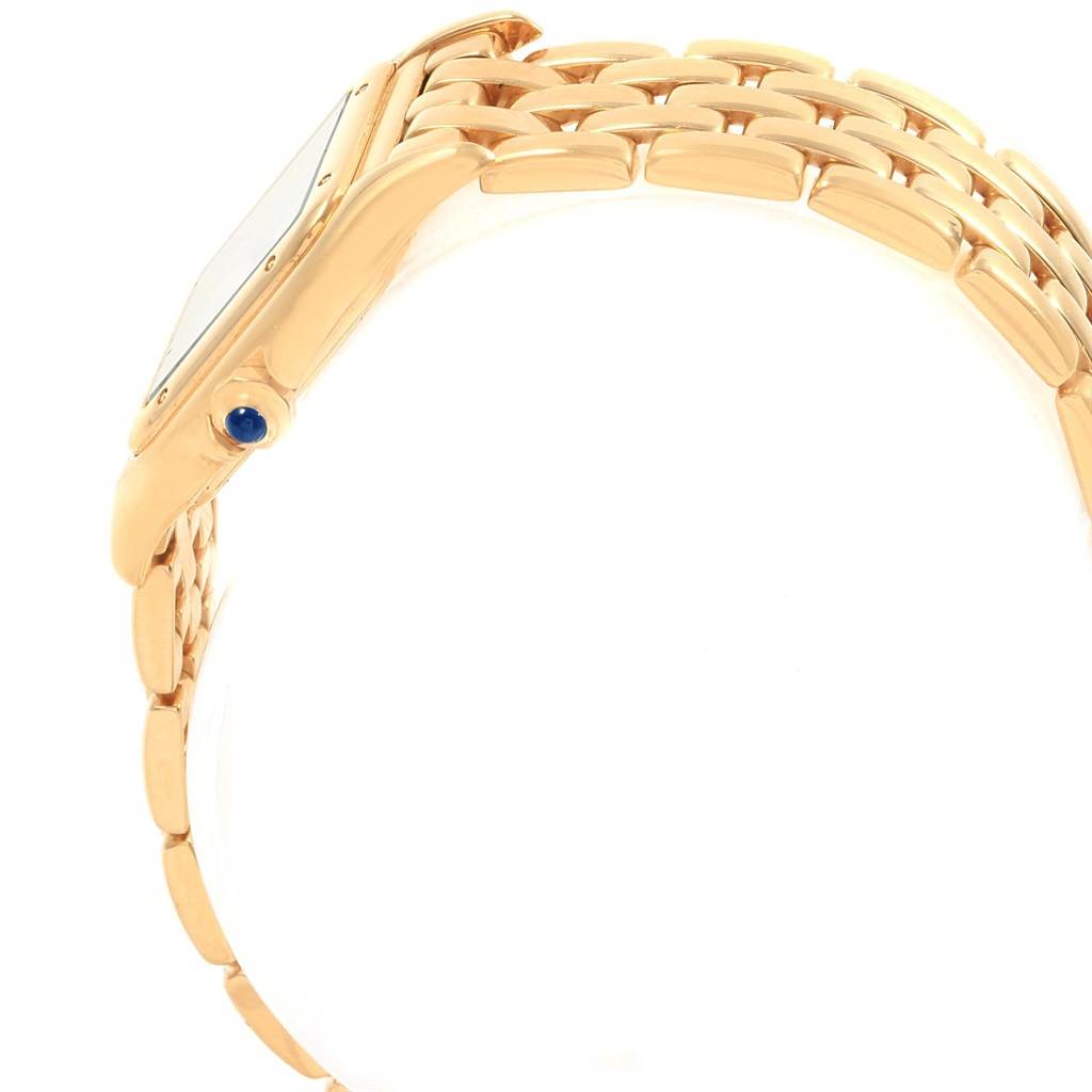 The image shows a side view of the Cartier Panthere W25022B9 Women's Yellow Gold Silver Dial W25022B9 Women's Yellow Gold Silver Dial watch, highlighting its bracelet and crown with a blue cabochon.