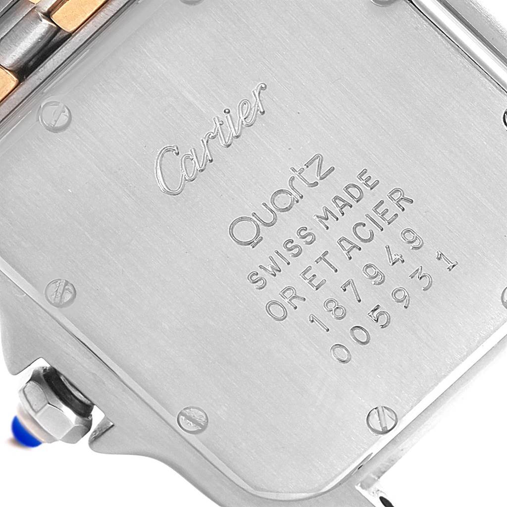 The image shows the back case of a Cartier Panthere W25028B6 Steel and Gold (two tone) Silver Dial W25028B6 Steel and Gold (two tone) Silver Dial watch, showcasing the engraving and screws.