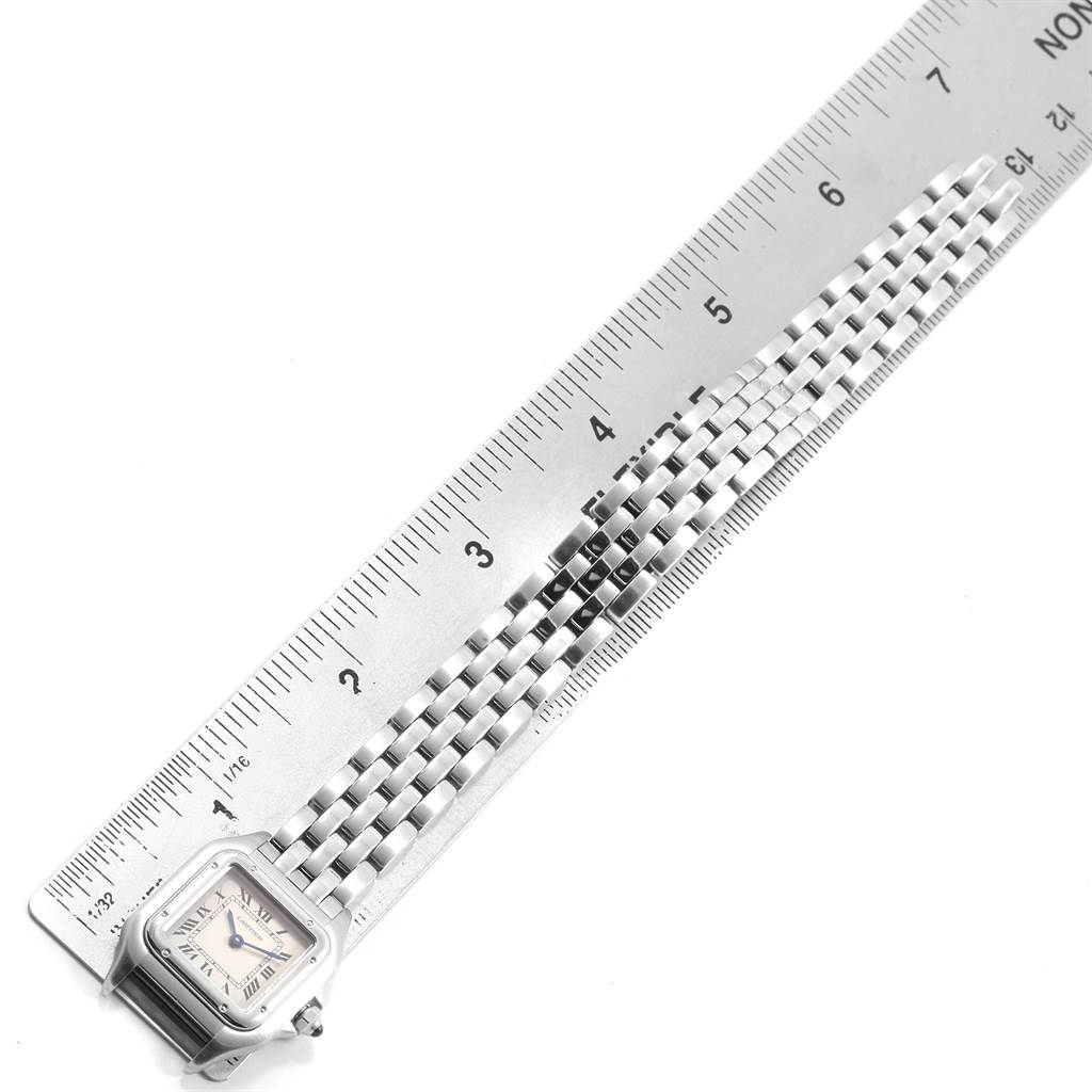 The image shows a top view of a Cartier Panthere W25033P5 Women
s Stainless Steel Silver Dial W25033P5 Women
s Stainless Steel Silver Dial watch and a metal ruler measuring its length.