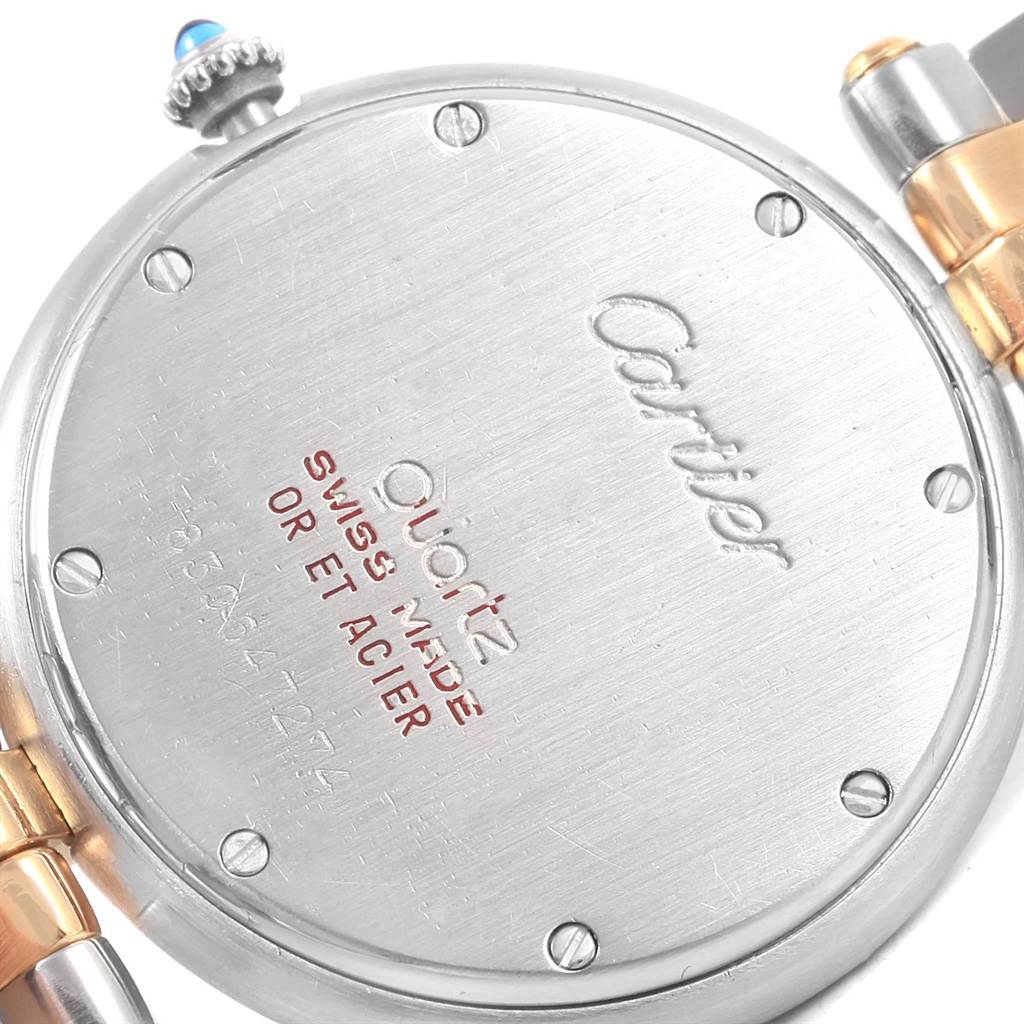 The image shows the back case and part of the bracelet of a Cartier Panthere Women
s Steel and Gold (two tone) Silver Dial Women
s Steel and Gold (two tone) Silver Dial watch.