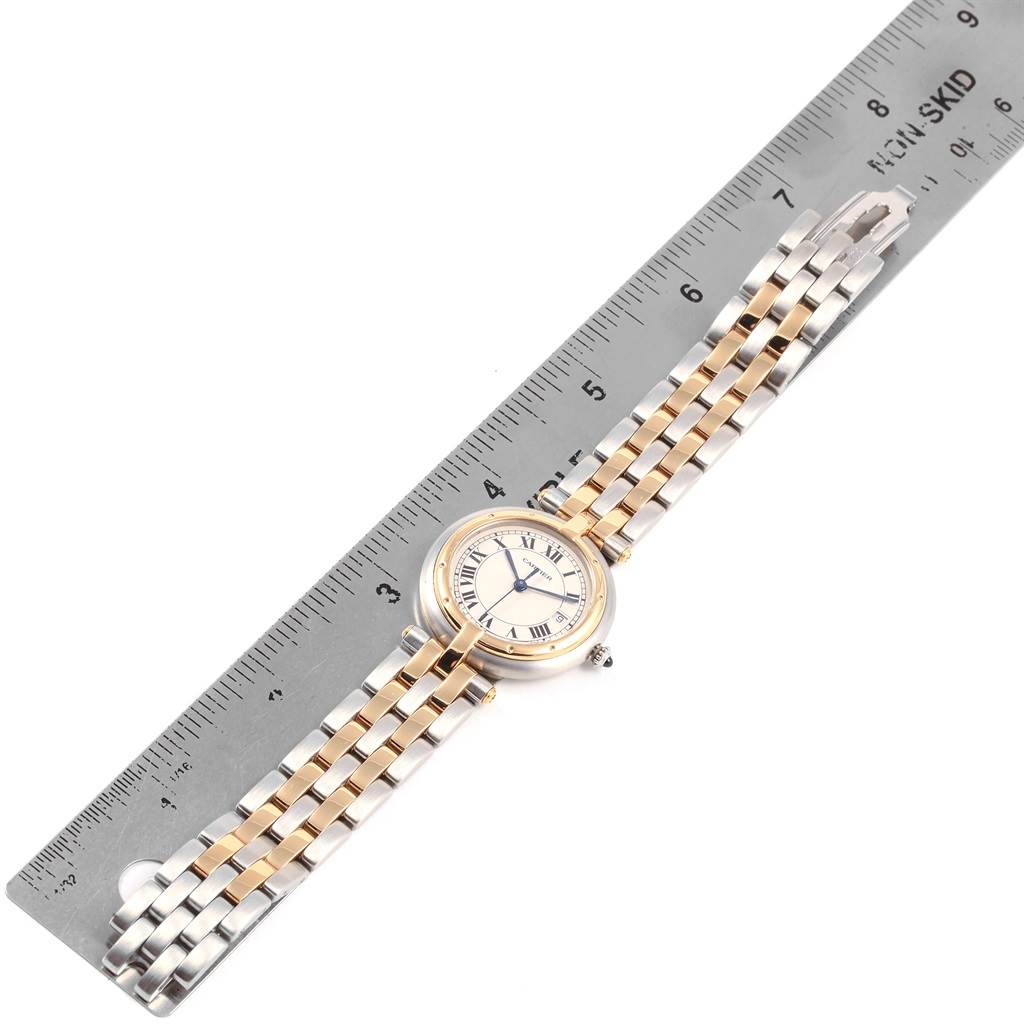 The Cartier Panthere Women
s Steel and Gold (two tone) Silver Dial Women
s Steel and Gold (two tone) Silver Dial watch is shown from a top-down angle, placed next to a ruler for size reference.