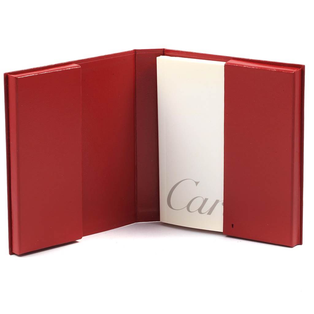 The image shows a Cartier Panthere W25029B6 Women
s Stainless Steel Silver Dial W25029B6 Women
s Stainless Steel Silver Dial watch
s open red leather warranty booklet with part of the Cartier logo visible.