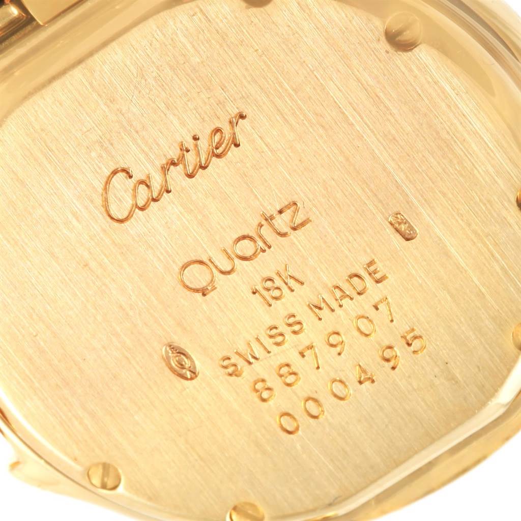 The image shows the back case of the Cartier Panthere 887907 Yellow Gold Silver Dial 887907 Yellow Gold Silver Dial watch, highlighting the engravings and case materials.