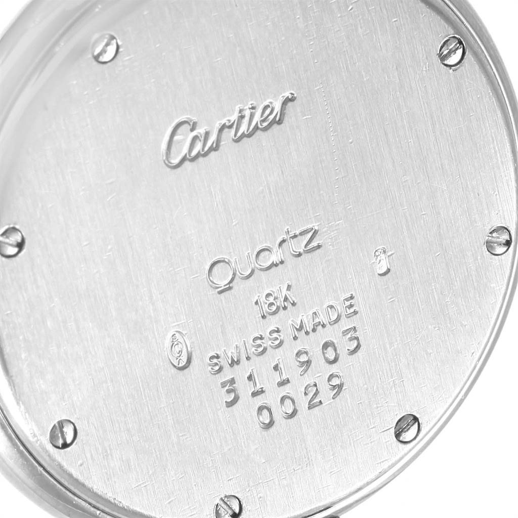 The image shows the rear case of the Cartier Panthere 0029 Women
s White Gold Silver Dial 0029 Women
s White Gold Silver Dial watch, showcasing engravings and screws.