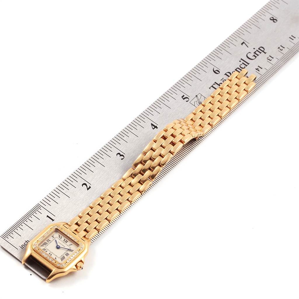 The image shows a Cartier Panthere WF3070B9 Women's Yellow Gold Beige Dial WF3070B9 Women's Yellow Gold Beige Dial model watch laid flat alongside a ruler, showcasing its face, strap, and approximate length.