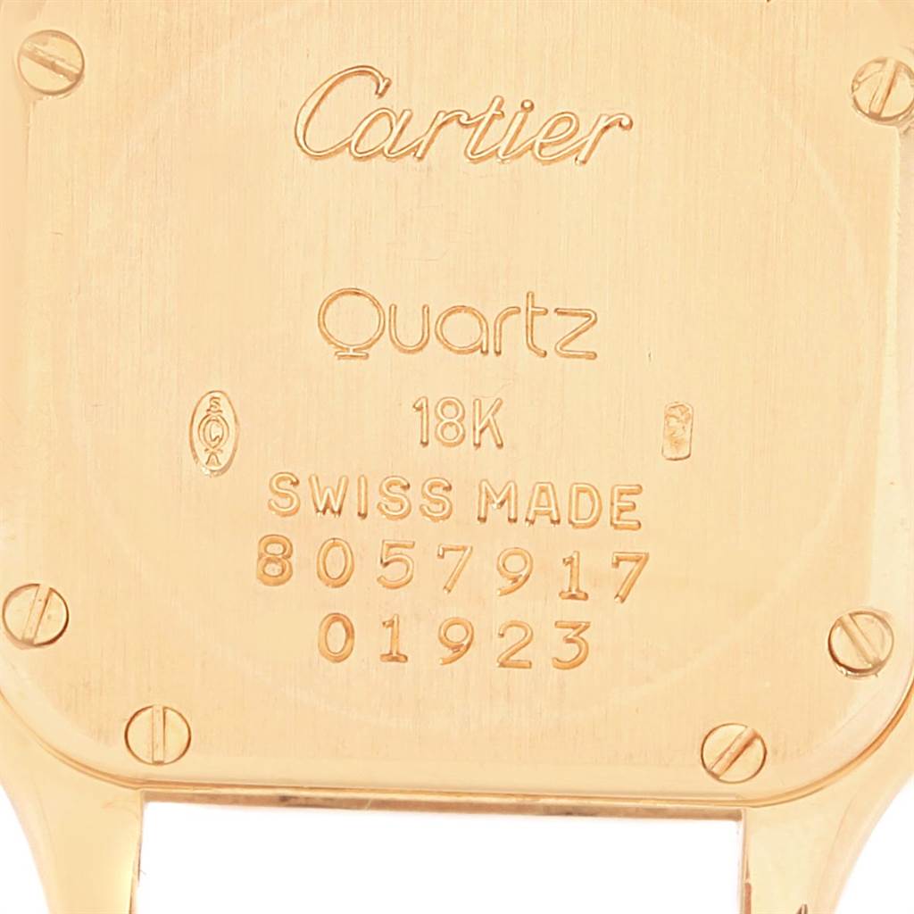 This image shows the case back of a Cartier Panthere W25022B9 Women's Yellow Gold Silver Dial W25022B9 Women's Yellow Gold Silver Dial watch, highlighting engravings and screw details.