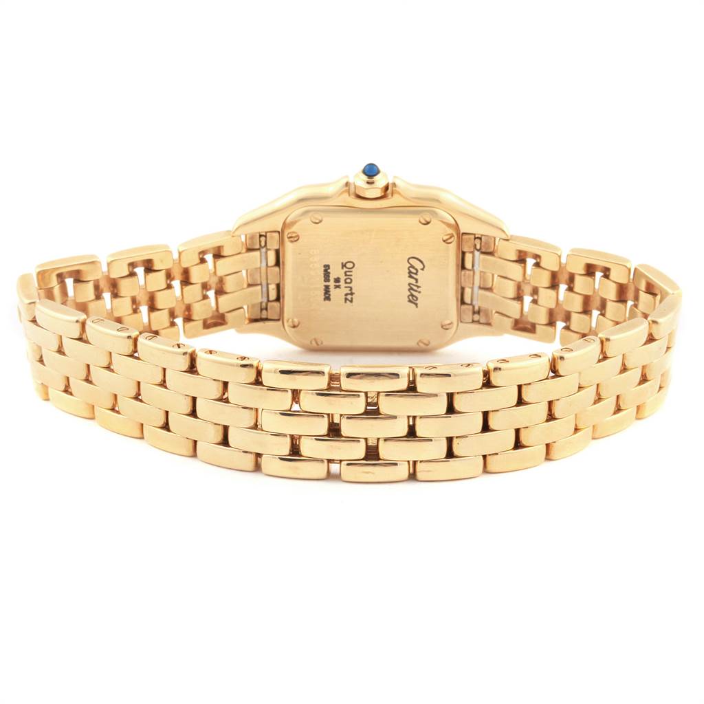 This image shows the back view of a Panthère model watch by Cartier, focusing on its gold bracelet and case back.