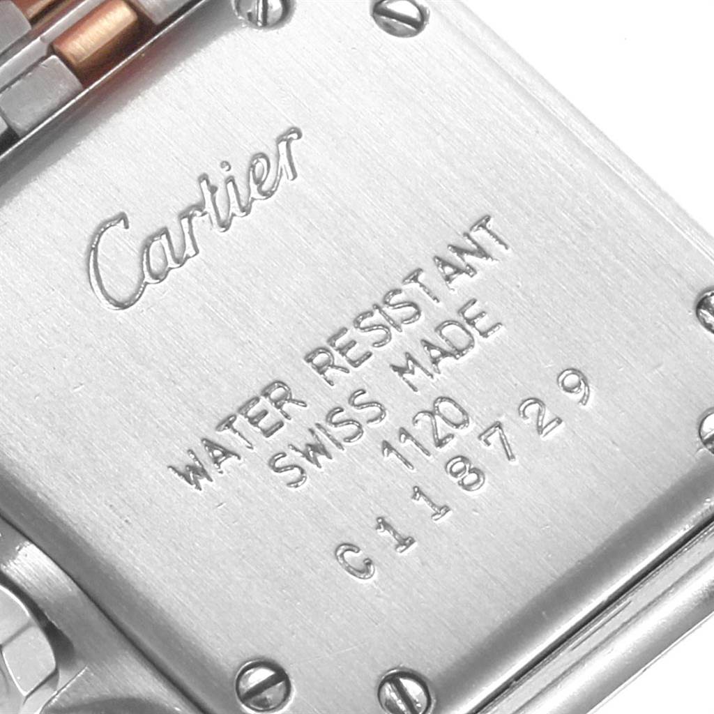 The image shows the backside of a Cartier Panthere W25029B6 Women
s Stainless Steel Silver Dial W25029B6 Women
s Stainless Steel Silver Dial watch, displaying engraving and screws.