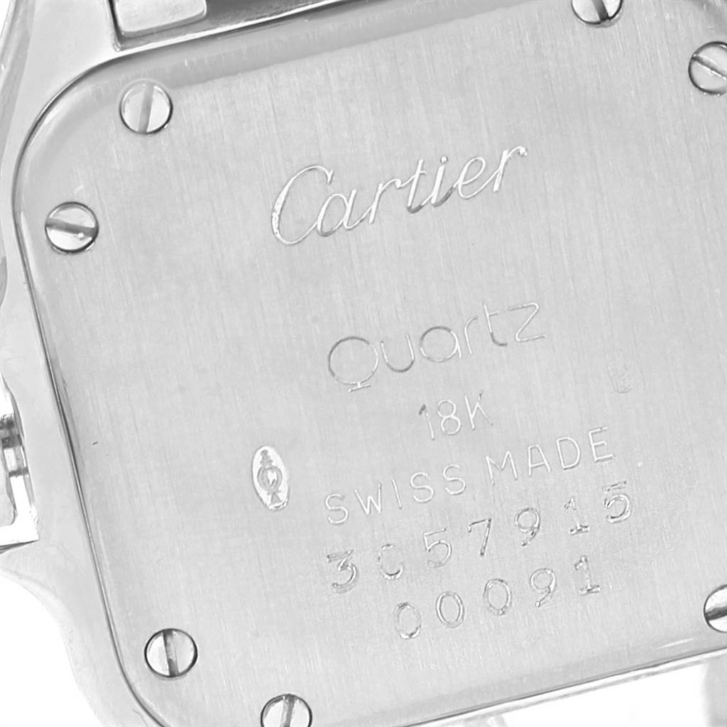 This image shows the back of a Cartier Panthere WF3091F3 Women
s White Gold Silver Dial WF3091F3 Women
s White Gold Silver Dial watch, featuring engravings and four screws.